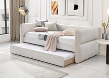 White sofa bed in a modern living room with a side table and decor.