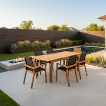 Wooden dining table with six matching chairs on a white background