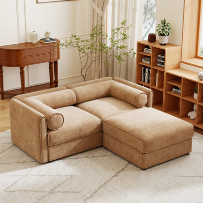 Beige sectional sofa in a living room with wooden furniture and decor.