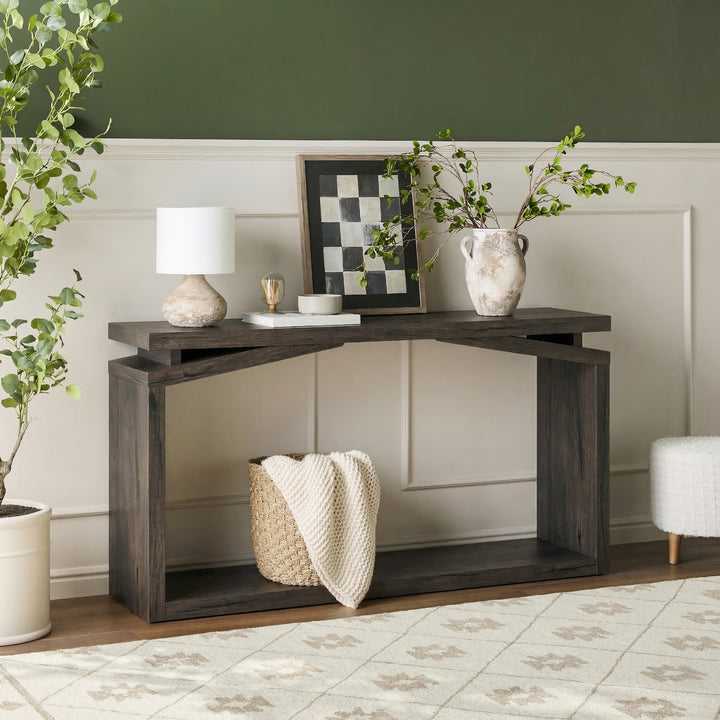 Console table with decorative items in a living room setting