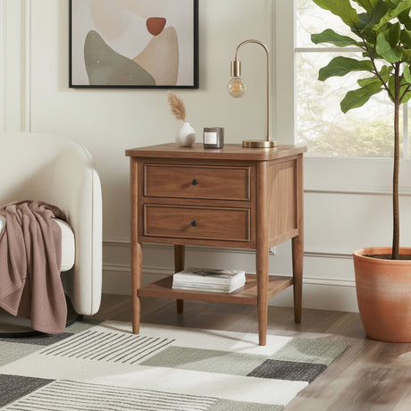 Wooden nightstand with lamp and books in a bedroom setting
