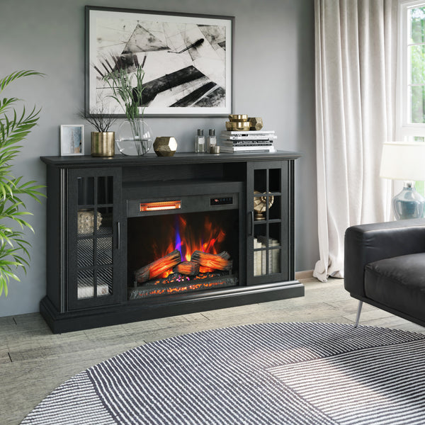 Living room with a black electric fireplace console, decorative items, and a gray sofa.